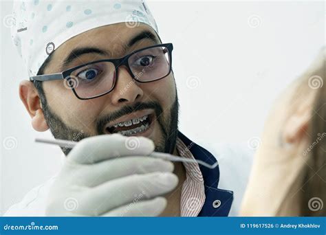 Funny Dentist Heals a Patient Stock Photo - Image of dentist, clinic: 119617526