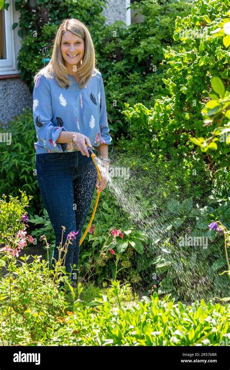 Gardening Woman Sprinkling Water Plant Hi Res Stock Photography And