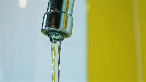 Water Flows From An Old Contaminated Tap With Calcium And Grime Into A