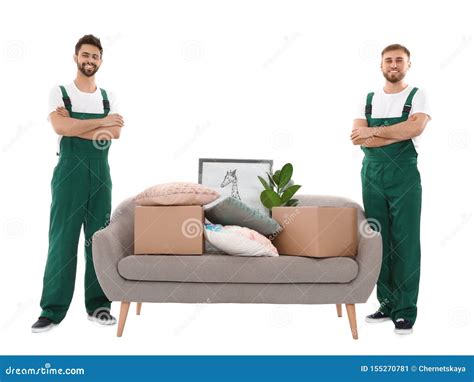 Young Workers Near Sofa With Stuff Isolated On White Stock Image