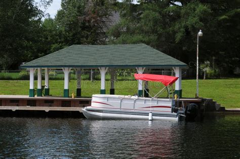 Boat at the covered dock stock photo. Image of pier - 16100558