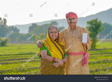 indian farmer couple standing agriculture stock photo