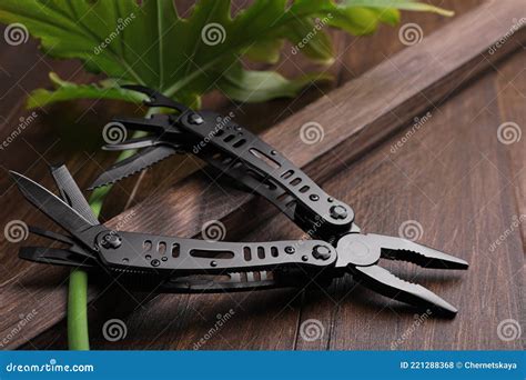 Modern Compact Portable Multitool On Wooden Table Stock Photo Image