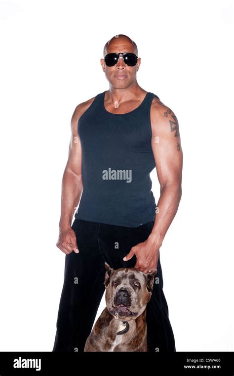 Buff man with dog Stock Photo - Alamy