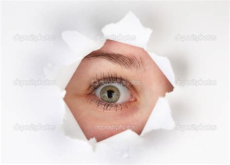 female eye   hole  sheet  paper stock photo