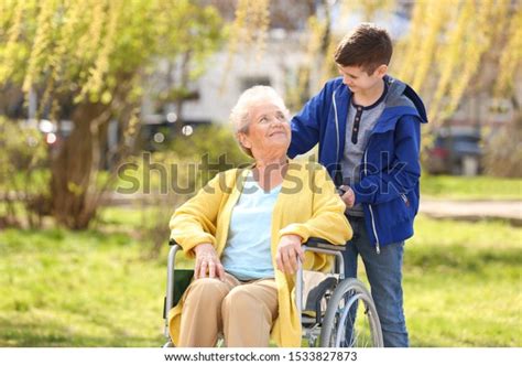 Senior Woman Wheelchair Her Grandson On Stock Photo