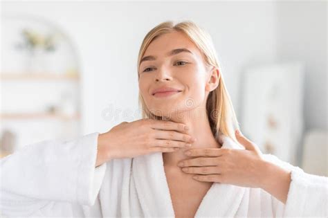 Pretty Blonde Woman Applying Moisturizing Cream On Her Neck Indoors Stock Image Image Of