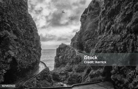 Dark Rainy Cliff And Coastal Highway In Madeira Spooky View Stock Photo