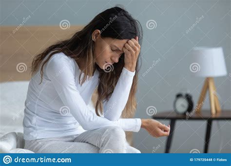 Unhappy Woman Sitting On Bed Feeling Depressed Thinking About