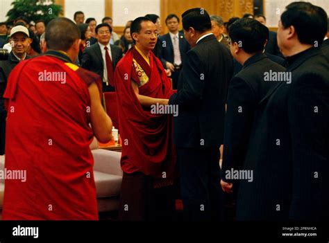 The Chinese Appointed Panchen Lama Gyaltsen Norbu Center Left The