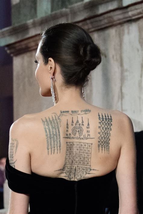 Angelina Jolie's tattoo artist breaks silence on mysterious new tattoo ...