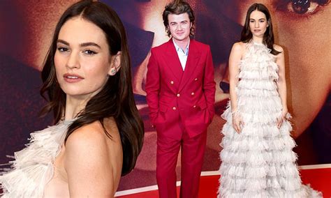 Lily James teases a glimpse of side boob in a dramatic white ruffled ...