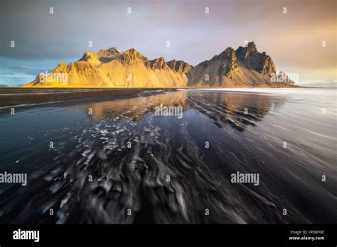 reflection  vestrahorn mountain  black sand  sunrise  spring