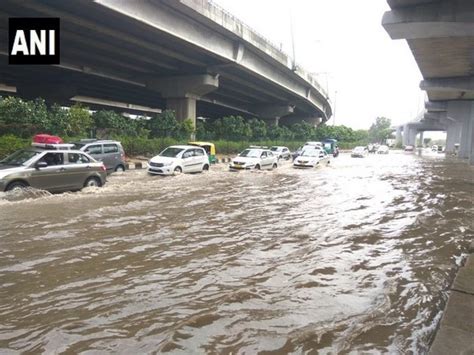 Rain Causes Waterlogging In Delhi Triggers Traffic Jams