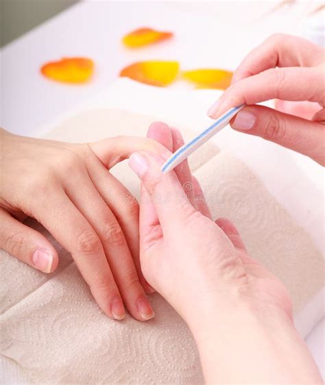 Beautician With File Filing Nails Female Client Woman Spa Beauty Salon