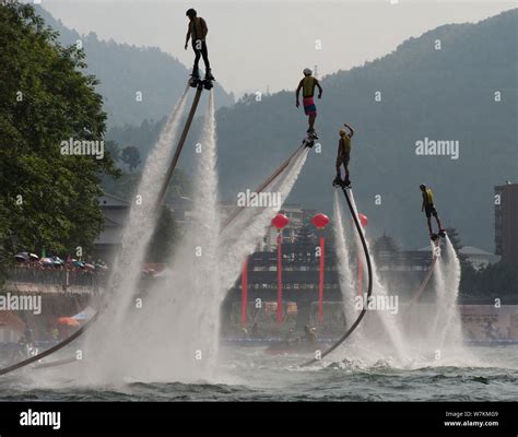 Performers show flyboarding stunts on water in Xuanen county, Enshi ...