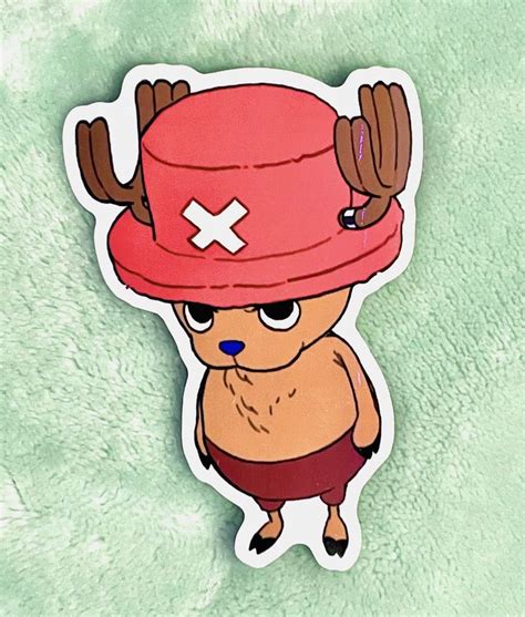 a sticker with an image of a cartoon character wearing a red hat and shorts