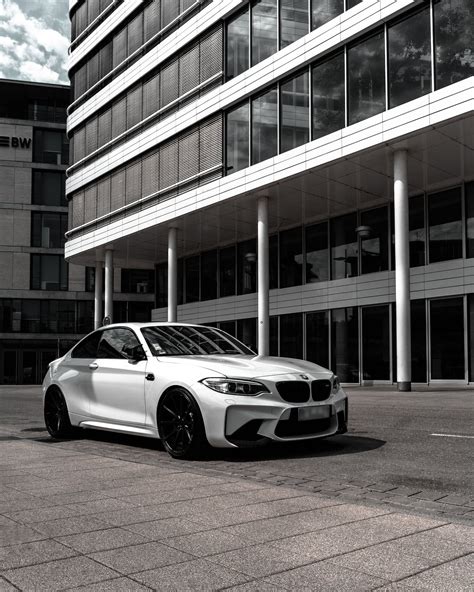 White Bmw M 3 Coupe Parked in Front of Building · Free Stock Photo