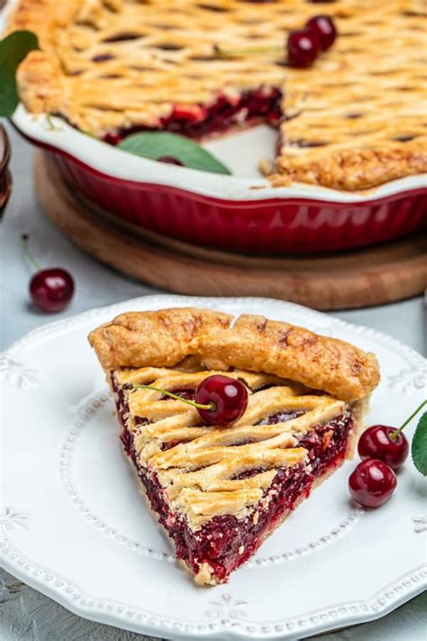 Cherry Pie Flaky Crust Piece On A Plate And The Whole Homemade Cherry