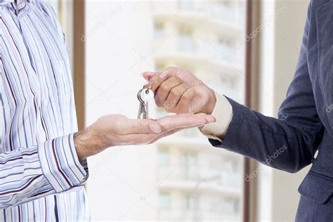 Handing Of Keys From One Man To Other Stock Photo By ©realinemedia 34774261