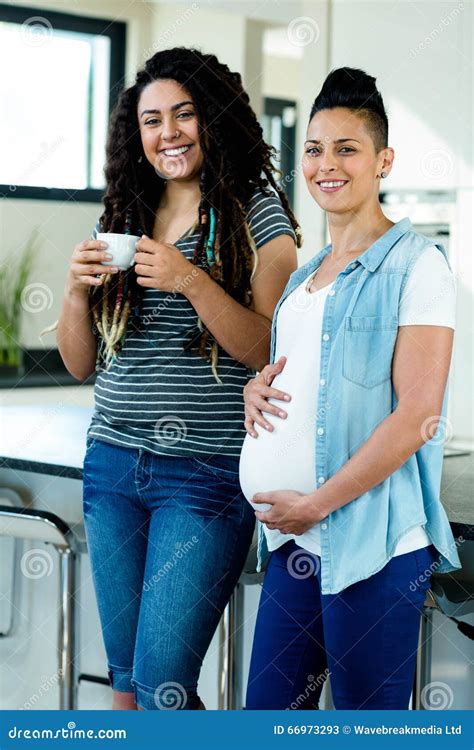 Portrait Of Pregnant Lesbian Couple Standing Together Stock Image Image Of Expecting