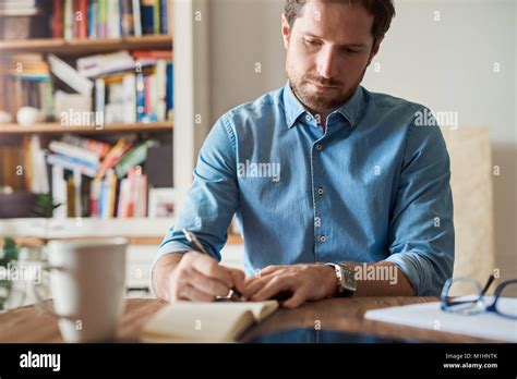 Man Writing Down High Resolution Stock Photography And Images Alamy