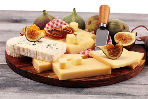 Cheese Platter with Different Cheese and Grapes and Figs and Nuts Stock Photo - Image of food ...