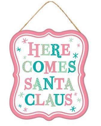 There Is A Sign That Says Here Comes Santa Claus