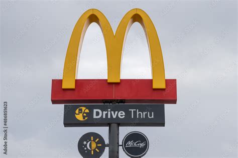 Close up of the McDonald's Golden Arches logo and drive thru sign Stock ...