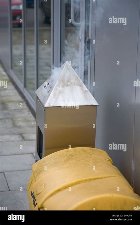 Cigarette Smoking Area Fire In Ashtray Ash Bin Outside Stock Photo Alamy