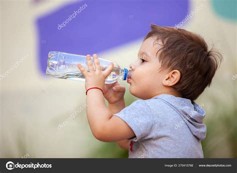 Boy Drinking Water Bottle Stock Photo by ©anpet2000 270415766