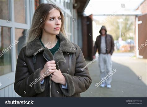 Woman Looks Frightened Because Stalker Follows Stock Photo 1377799130