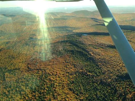 The View From An Airplane Looking Down On Trees And Land In The