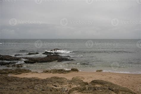 Peaceful beach scene with rocks 10387746 Stock Photo at Vecteezy