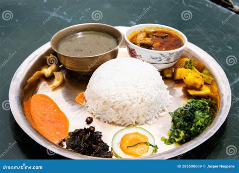 Traditional Nepali Thakali Dish Of Rice Lentils Curry And Chutney Aka