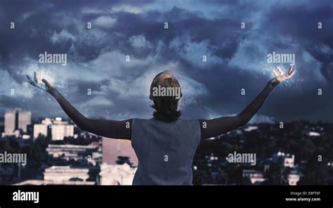 Rear View Of A Woman Holding Her Arms Out To A Stormy Sky Argentina