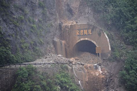 China Floods Sweep Away Bridges Houses And Hillsides Killing At Least