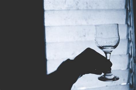 Premium Photo Close Up Of Hand Holding Glass Of Wine