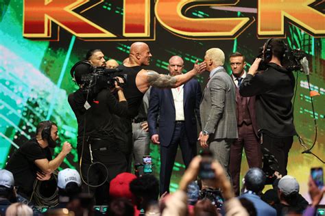 The Rock Reigns Rhodes And Rollins Bring Fireworks In Unforgettable