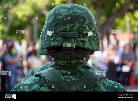 A Closeup Of A Mexican Soldier In Combat Helmet And Camouflage During A