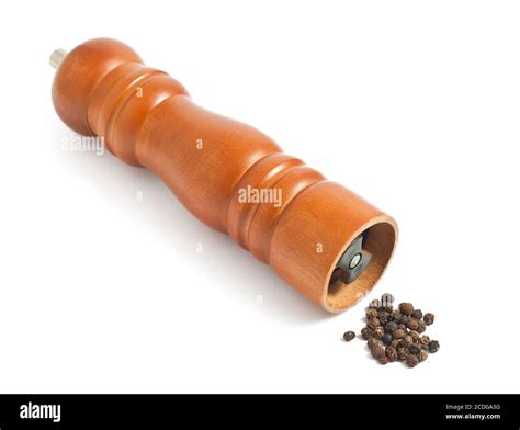 Wooden pepper grinder on white background Stock Photo - Alamy