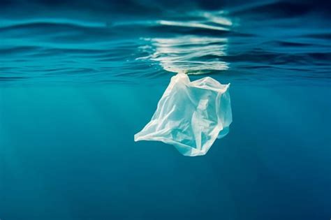 Premium Ai Image White Plastic Bag In The Ocean Or Sea Underwater