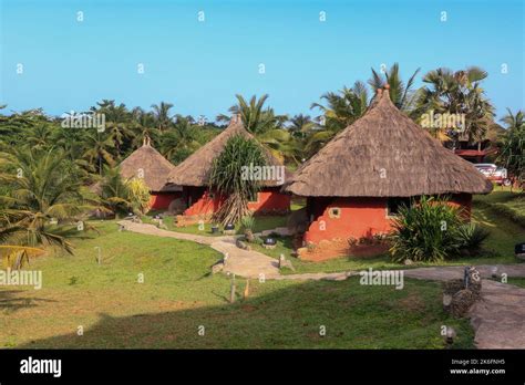 Traditional African Houses On The Axim Tropical Beach In Ghana West