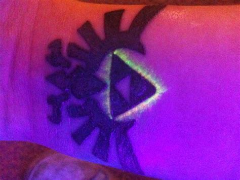 Hyrule crest tattoo under the blacklight :D by allisynVengeance on ...