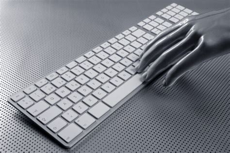 Premium Photo | Computer keyboard aluminum silver hand