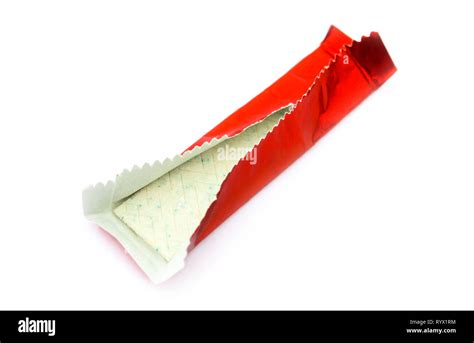 Chewing gum in red shiny wrapper isolated on white Stock Photo - Alamy