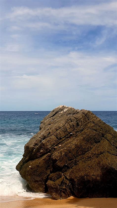 Stone Rocks On Ocean Waves Beach Sand Under White Clouds Blue Sky K Hd