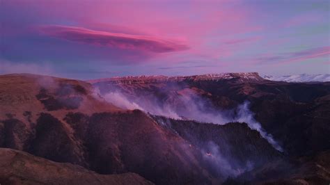 Majestic northern mountains under bright purple sky aerial top view ...