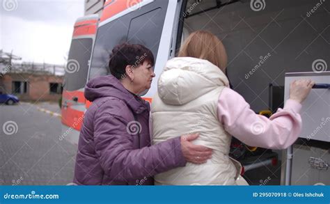 Female Ambulance Paramedic Helping Pregnant Girl Get Into Ambulance Stock Footage Video Of