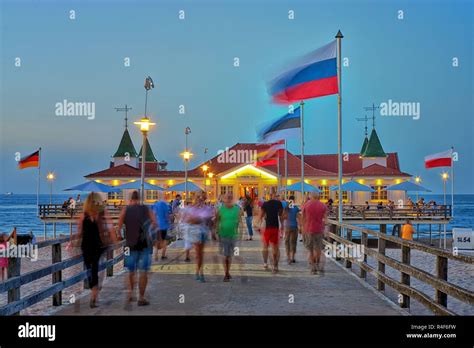 Pier Ahlbeck On The Baltic Sea With National Flags In The Wind